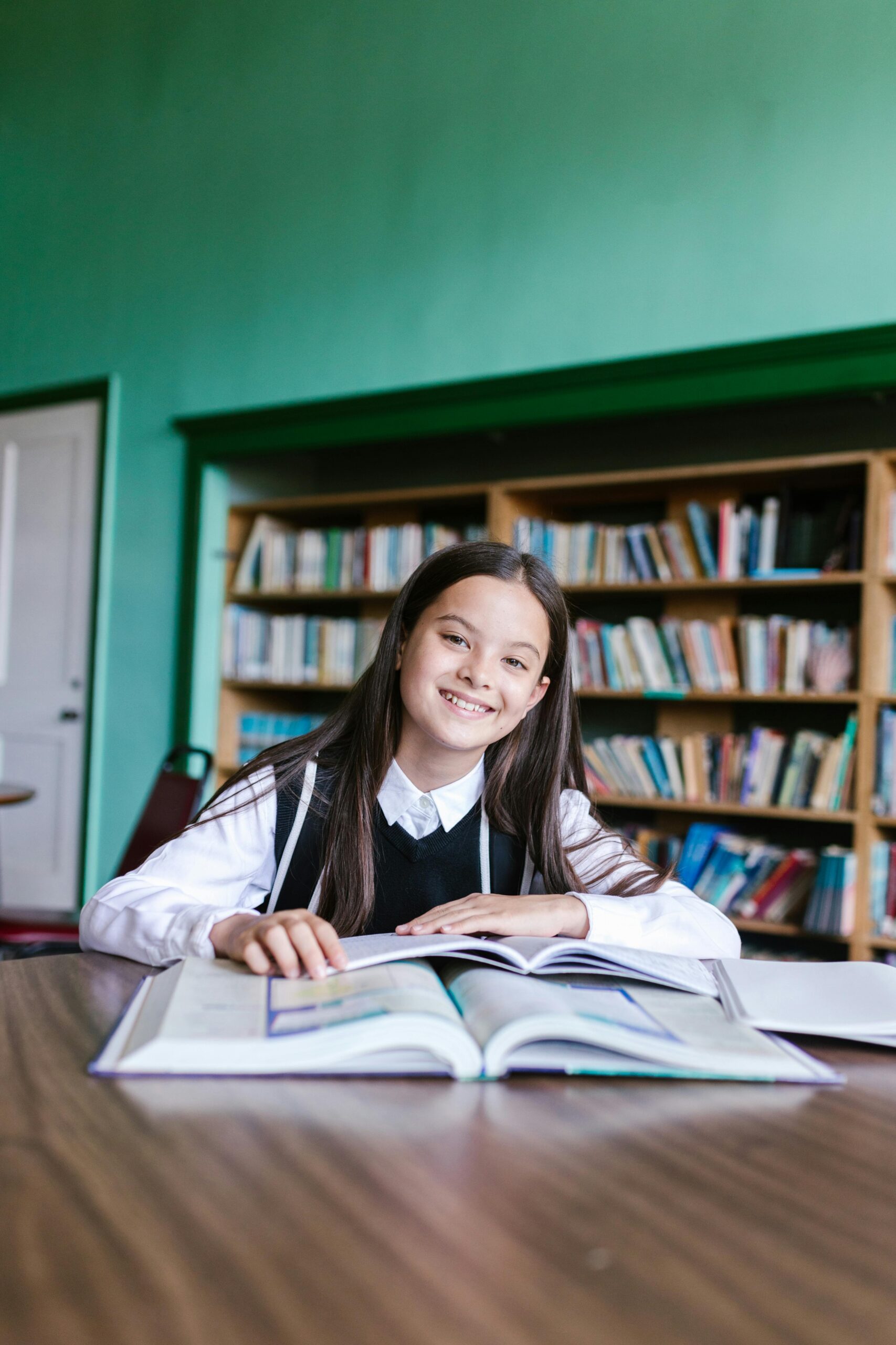 Child reading with tutor